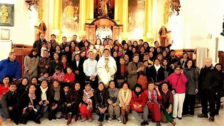 Filipinos in Seville after after New Year's Mass.